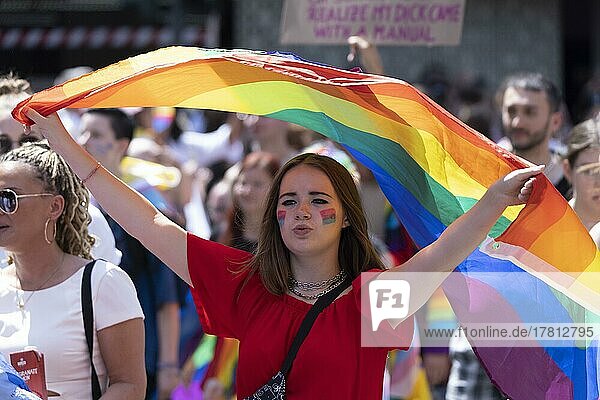Woman with rainbow flag at the CSD parade  Cologne  North Rhine-Westphalia  Germany  Europe