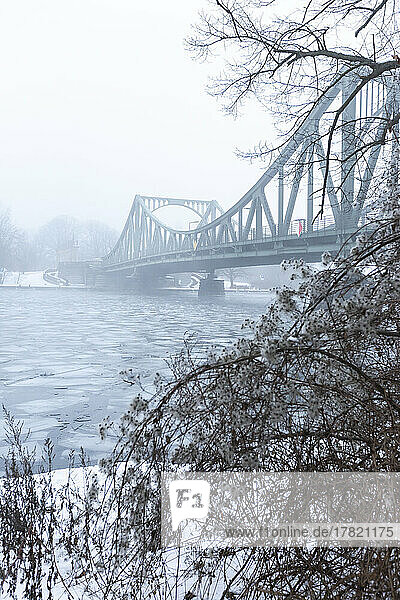 Germany  Brandenburg  Potsdam  Ice floating in river Havel with Glienicke Bridge in background