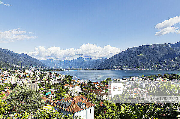 Switzerland  Ticino  Locarno  City houses with Lake Maggiore and surrounding mountains in background