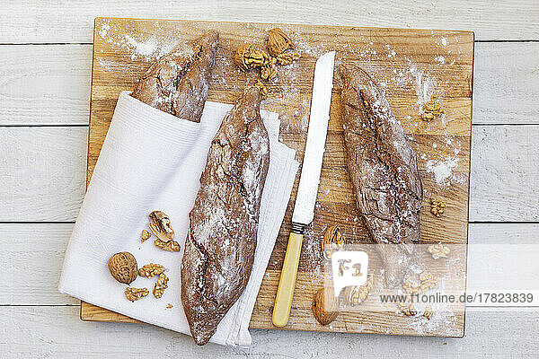 Studio shot of loaves of homemade whole wheat bread with walnuts