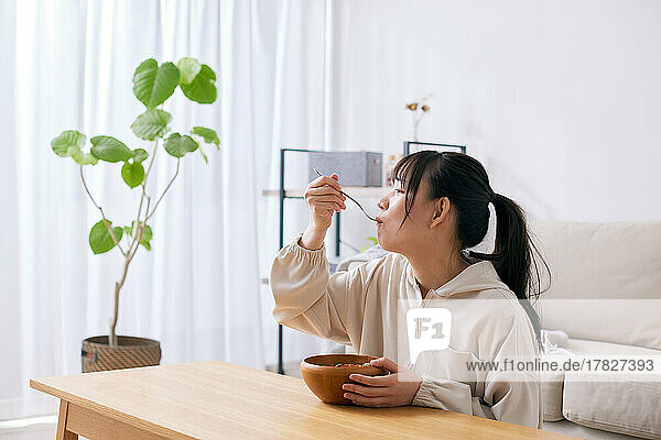 Young Japanese woman enjoying a meal