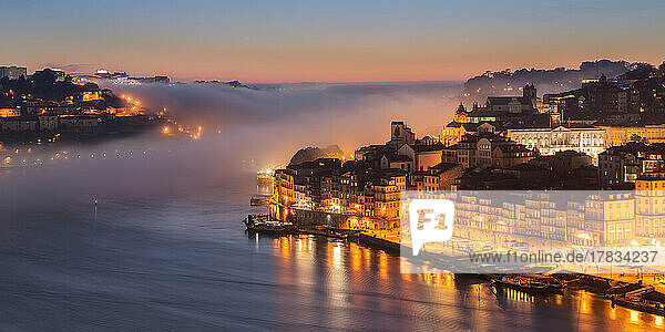 Porto at sunset with the sea fog rolling in  Porto  Portugal  Europe