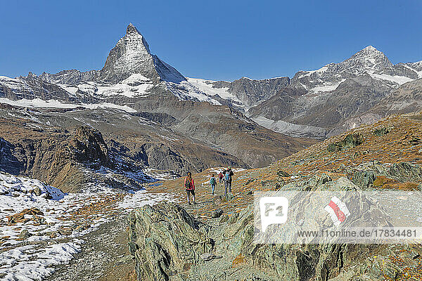 Hikers on Gornergrat  Matterhorn Peak  4478m  Zermatt  Valais  Swiss Alps  Switzerland  Europe