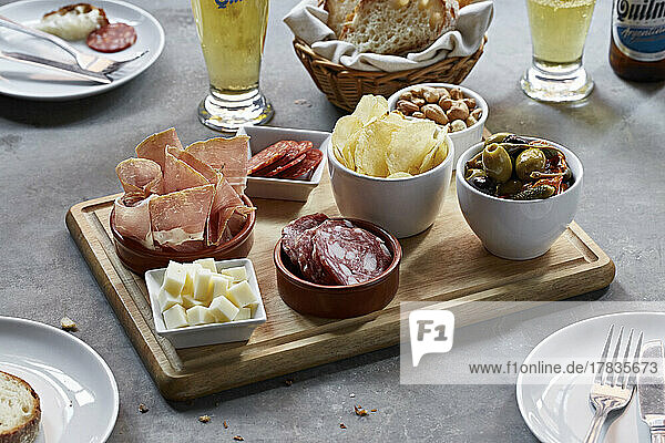 Snack selection board- cured meats  cheese  olives  nuts and crisps