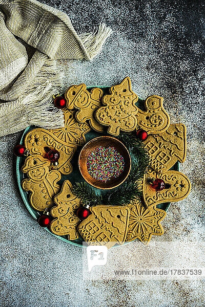 Tasty cookies for Christmas tree decoration on concrete table