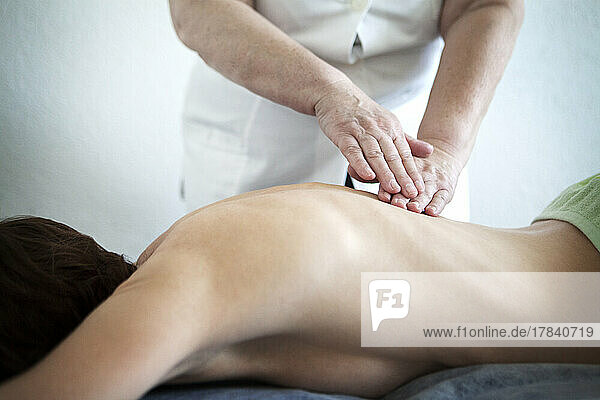 Manual lymphatic drainage performed by a doctor.