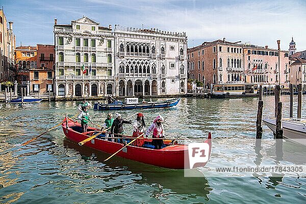 Rowing boat with carnival masks in front of Palazzo Ca dOro on the Grand Canal  Venice  Veneto  Adriatic Sea  Northern Italy  Italy  Europe