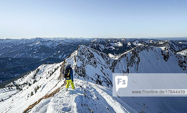 Ski tourers in winter on the snow-covered Rotwand  mountains in winter  Schlierseer Berge  Mangfall mountains  Bavaria  Germany  Europe