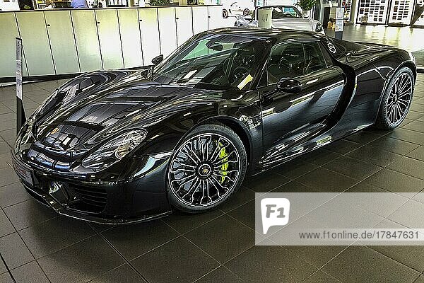 Supercar sports car Porsche 918 hybrid  plug-in hybrid with two electric motors and mid-engine in Porsche showroom  Germany  Europe