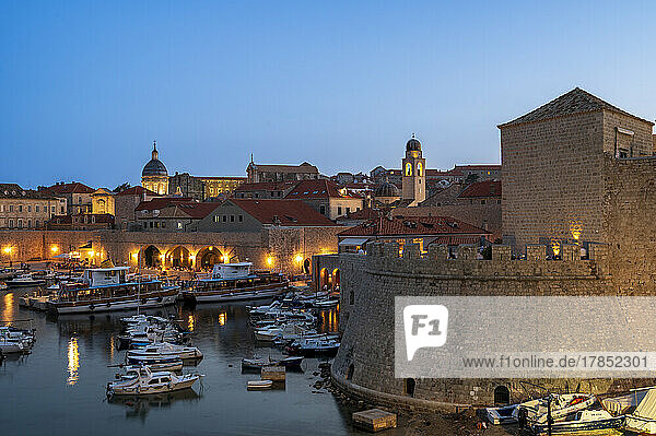 Evening view of the city walls and Old Port of Dubrovnik  UNESCO World Heritage Site  Dubrovnik  Croatia  Europe