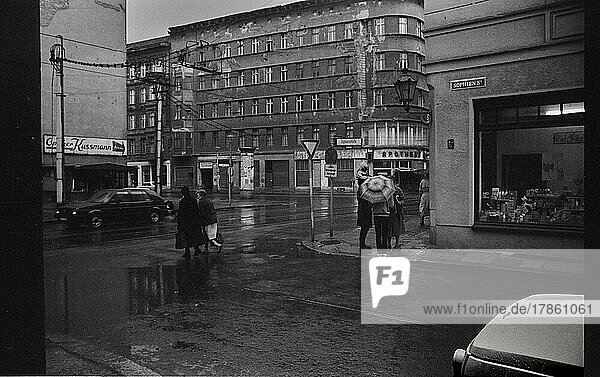 GDR  Berlin  22. 3. 1988  Sophienstraße  corner of Rosenthaler Straße  in the rain  the Rosenapotheke in the background