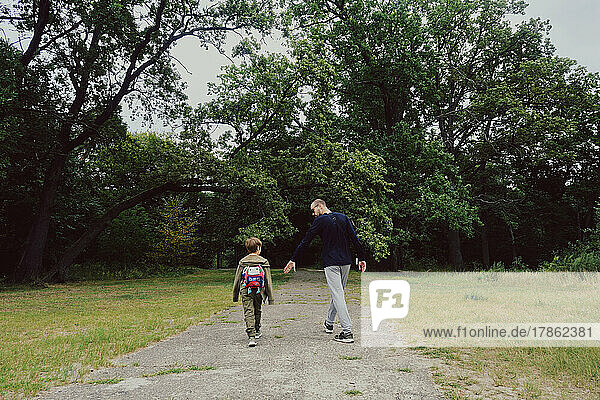 Kid in the forest with father. Family and nature loving concept