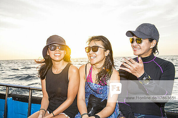 three female friends on a boat trip at Tubbataha reef