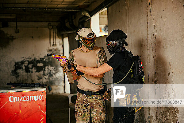 Airsoft soldiers helping each other in the game