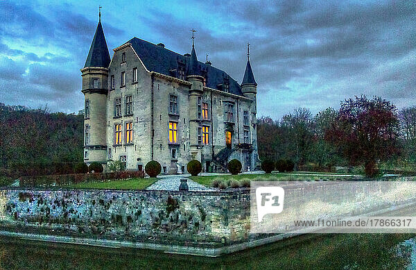 The illuminated moated castle Schaloen in Valkenburg aan de Geul at blue hour  Holland  Netherlands  Europe.