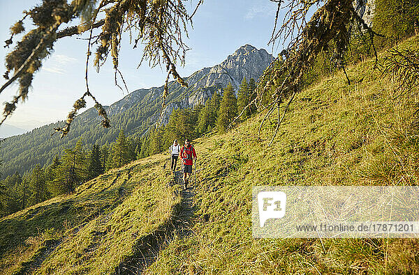 Friends walking on trail at mountain  Mutters  Tyrol  Austria