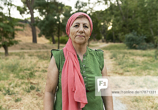 Senior woman wearing headscarf at park