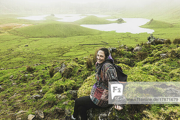 Young woman enjoying at volcanic crater Corvo  Azores  Portugal