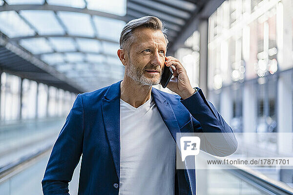 Mature businessman talking on mobile phone