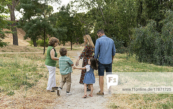 Family walking together on dirt road