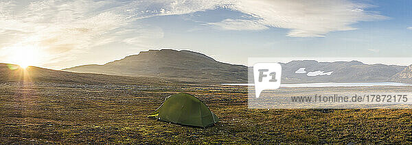 Norway  Lone tent pitched on plateau in Hardangervidda National Park at sunrise