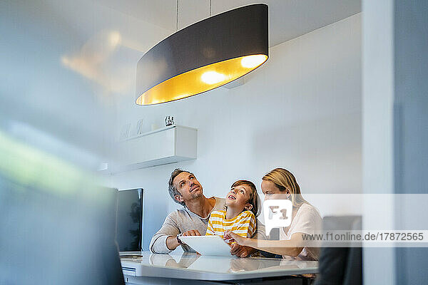 Family controlling ceiling lamp with tablet PC in Smart Home