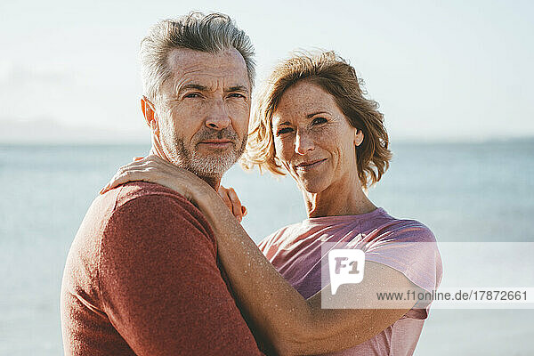 Happy mature couple on vacation at beach