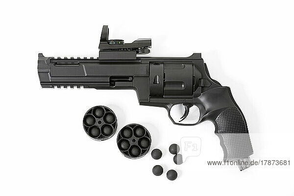 Co2 revolver with rubber bullets on white background