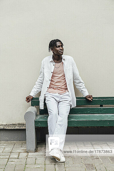 Thoughtful man sitting on bench