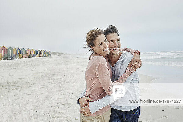 Affecionate couple embracing on the beach