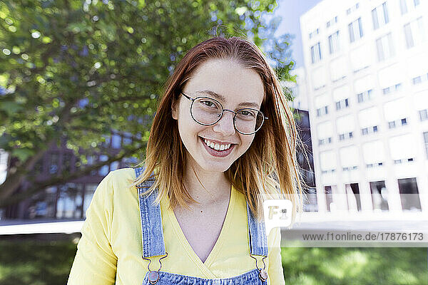 Happy young woman wearing eyeglasses