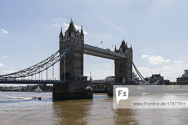 Tower Bridge over Thames river on sunny day  London  England