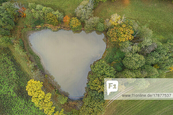 Drone view of small heart-shaped lake in Franconian Heights