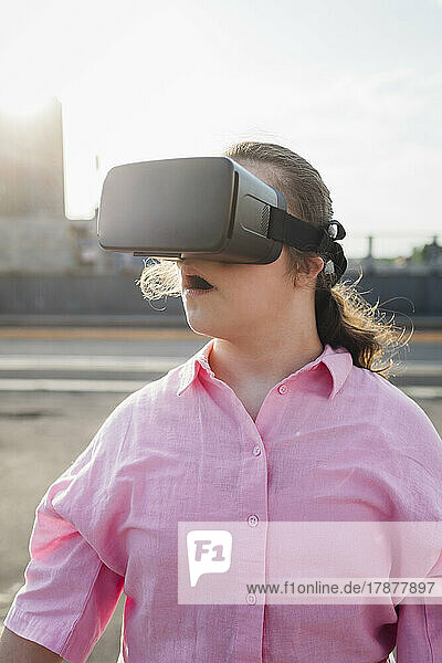 Teenage girl using virtual reality simulator