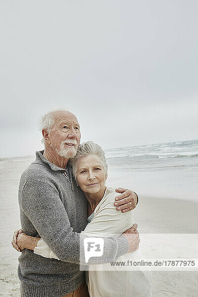 Senior couple embracing at the sea
