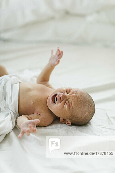 Newborn boy (0-1 months) crying