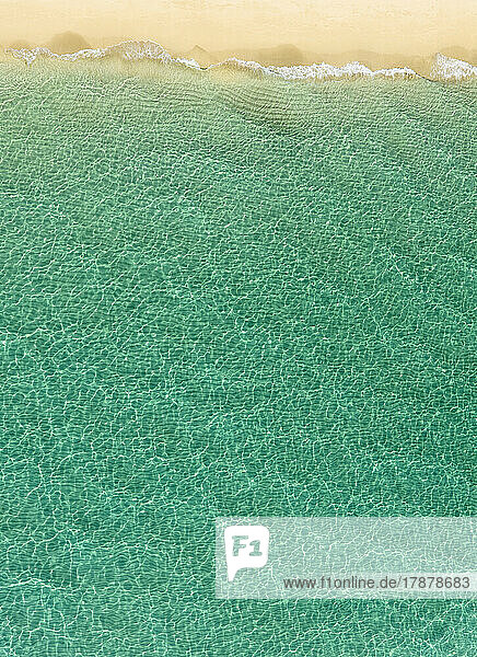 Overhead view of turquoise ocean and beach