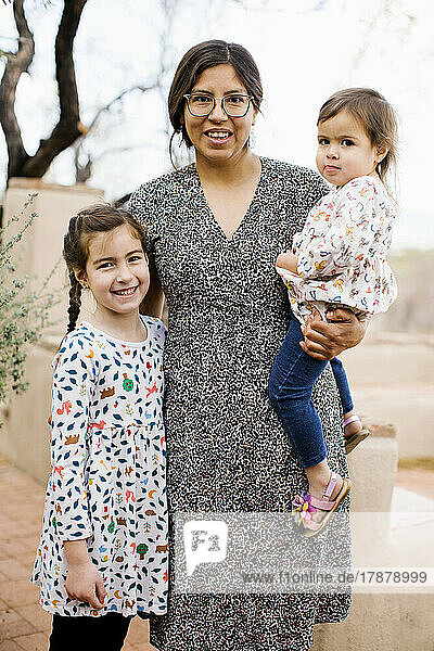 Portrait of mother with two daughters (2-3  8-9)