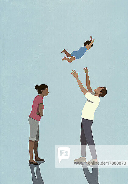 Angry wife watching husband throwing baby son overhead