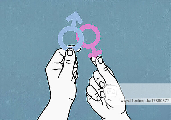 Hands holding pink female symbol and blue male symbol