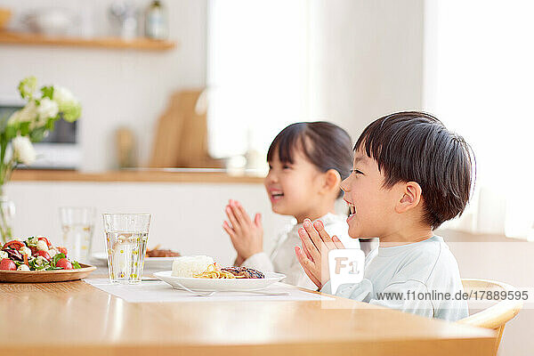 Japanese kids eating together at home