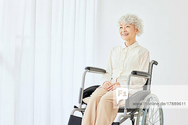 Japanese senior woman on a wheelchair