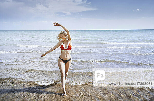 Happy woman having fun at beach