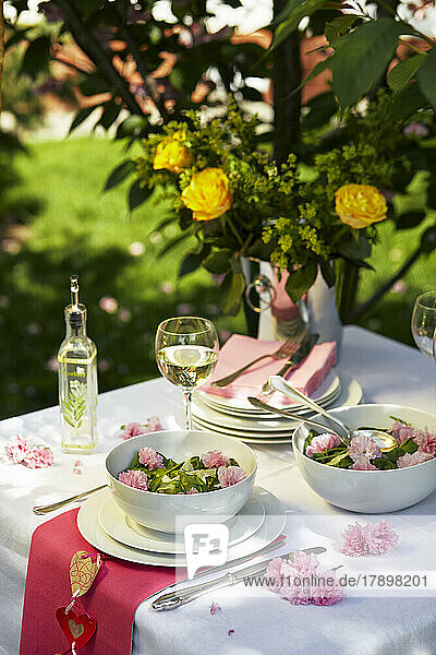 Elegant spring decorated table with edible flowers