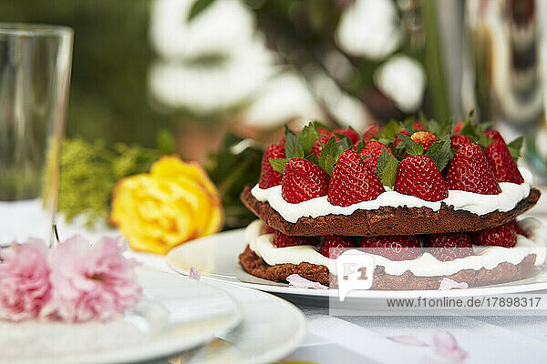 Strawberry cake on spring decorated table