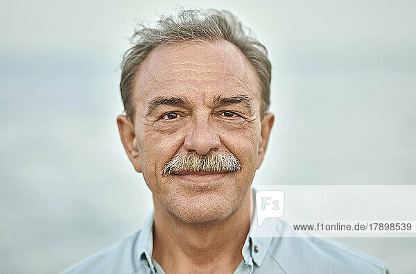 Smiling senior man with gray hair