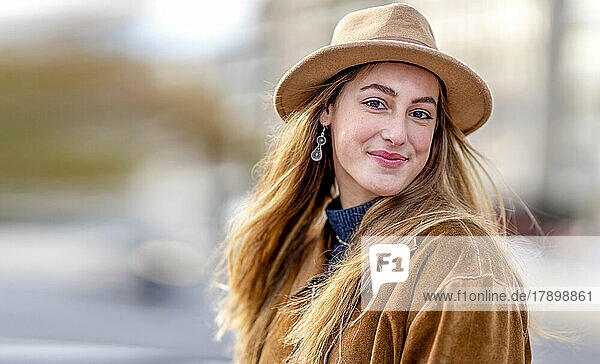 Beautiful woman wearing jacket and hat