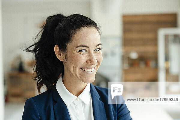 Portrait of happy brunette businesswoman