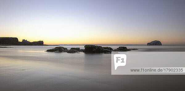 UK  Scotland  Long exposure of Firth of Forth at sunset with Bass Rock in background