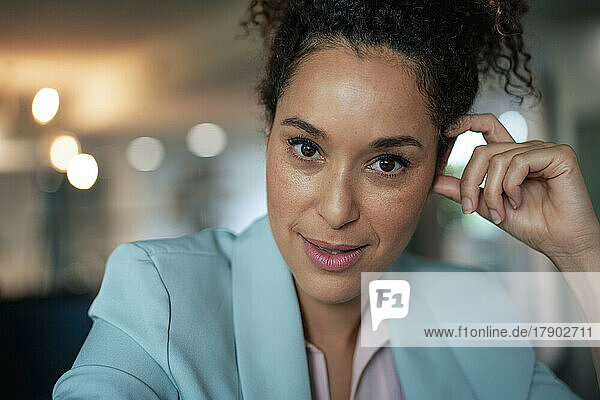 Smiling confident mature businesswoman at workplace